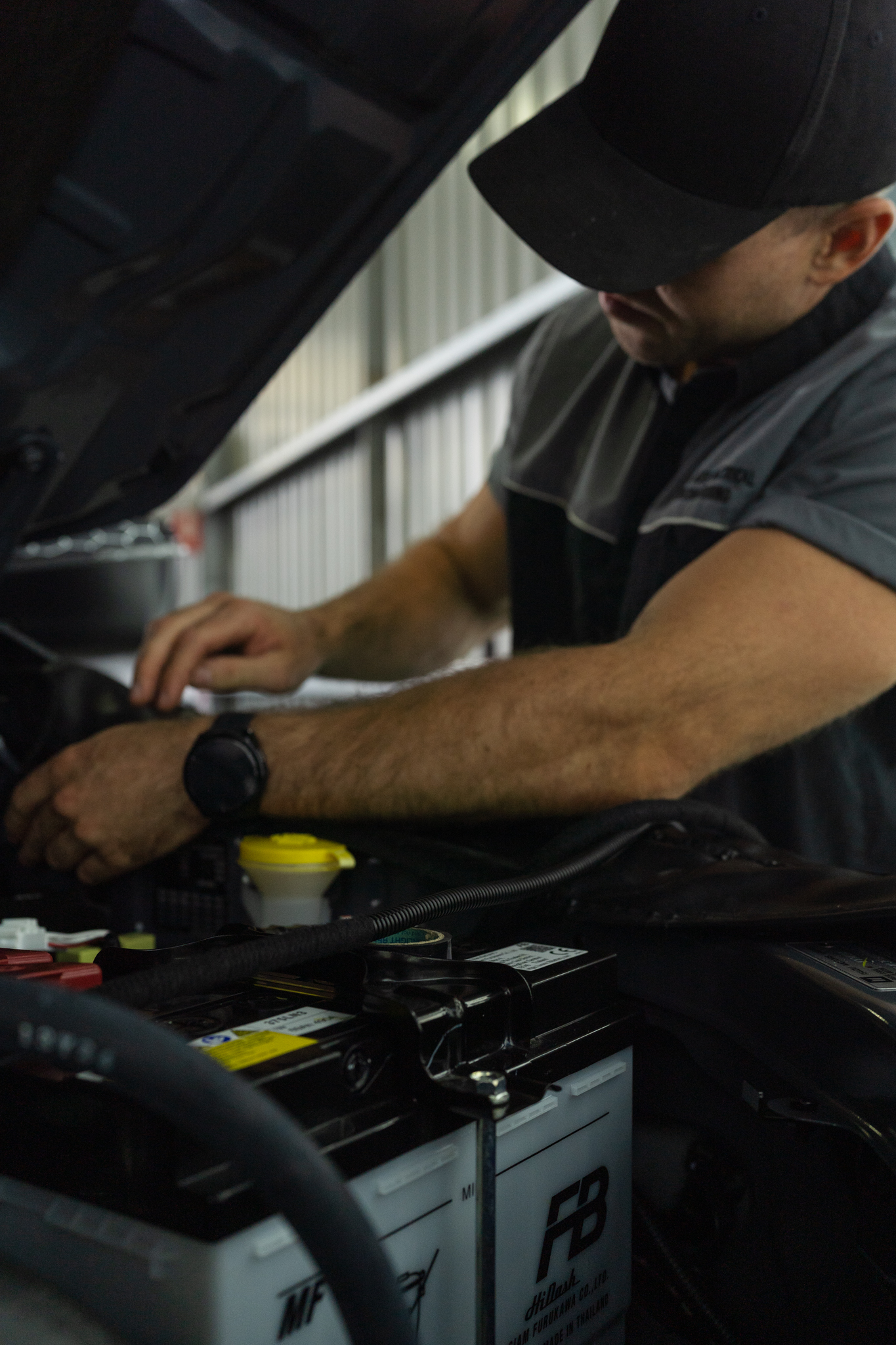 Coastal Auto Electrical technician working in an engine bay at the South Nowra workshop, serving Huskisson and the Shoalhaven